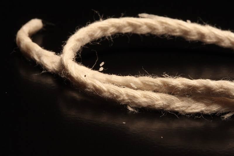 Close-up of a burning candle wick